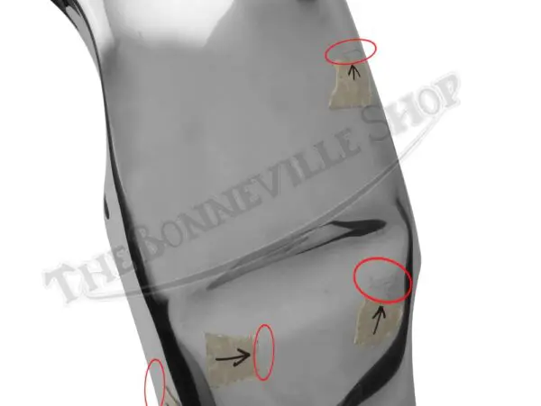 Shiny fender with marked imperfections.